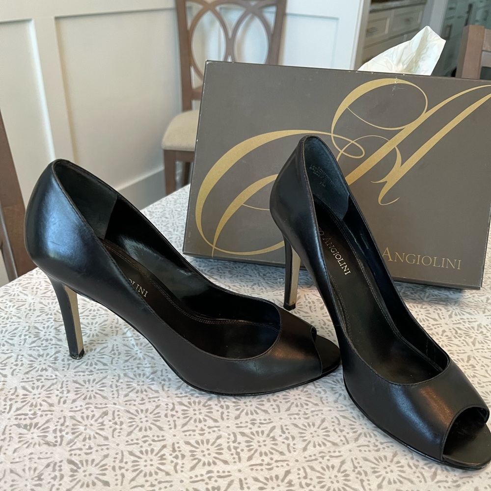 Black leather professional heels.  Minimal wear. Comfortable and classy.